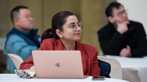 Attendee looks toward speaker at Analytics Without Borders conference.